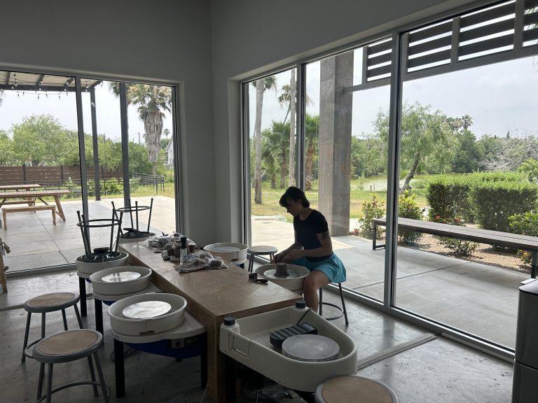 The pottery wheels are available for one-time classes and members. The large windows overlook the resacas and allow participants to experience some of Brownsville’s natural beauty. Photo Courtesy of Annelise.