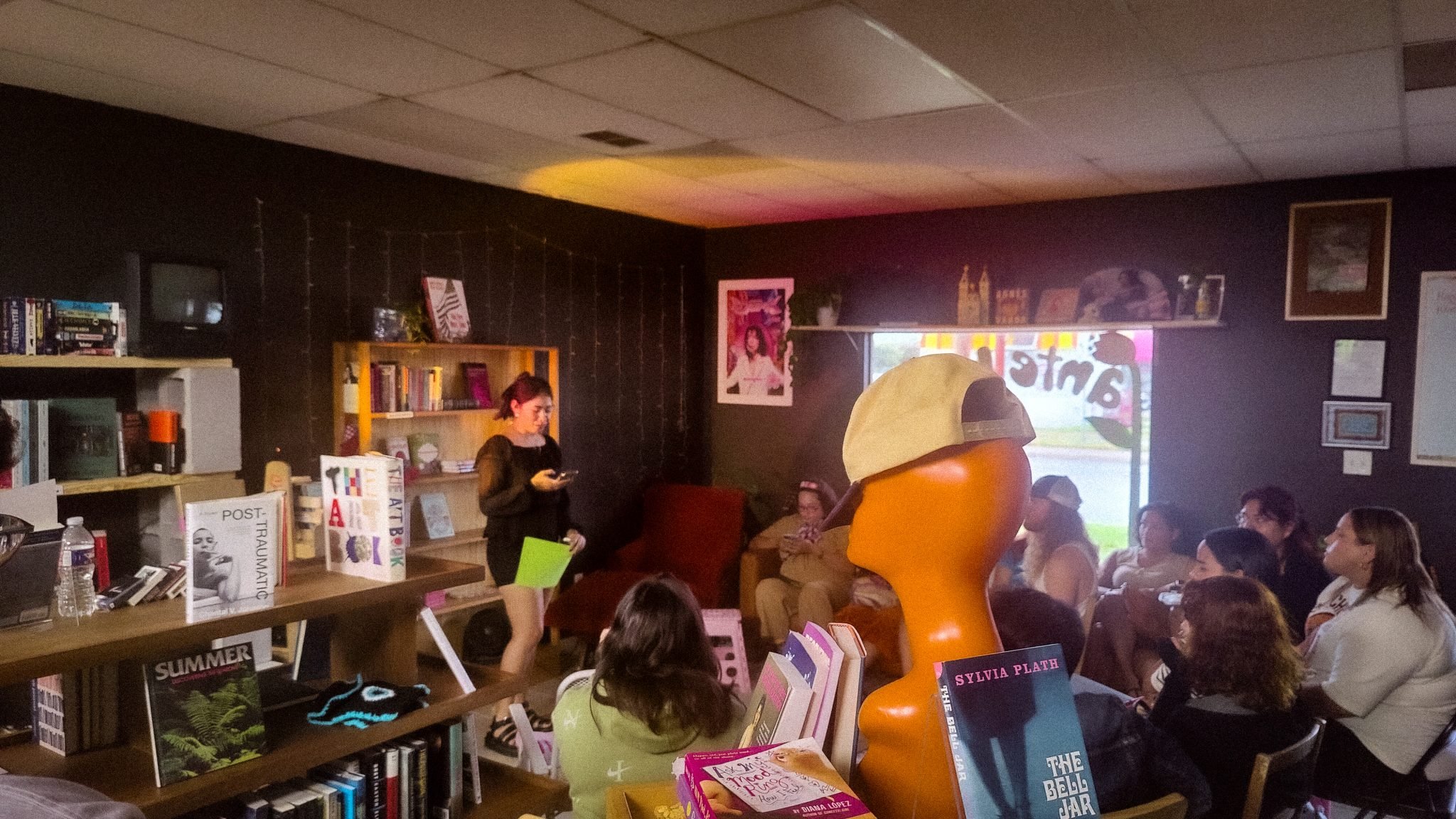 A group of people sitting and listening to poetry being read during one of Ante Books’ poetry nights.