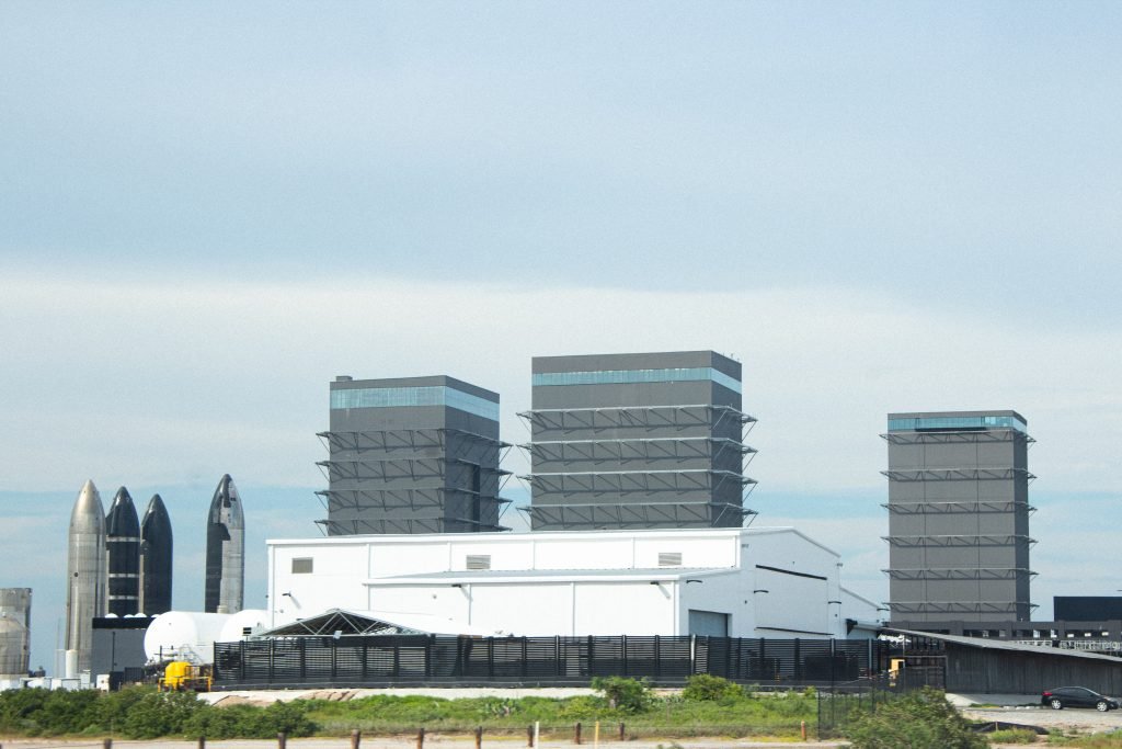Rockets and buildings of Starbase at Boca Chica Beach.