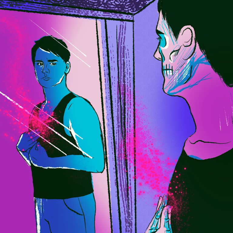 A young man looks at themselves in the mirror.