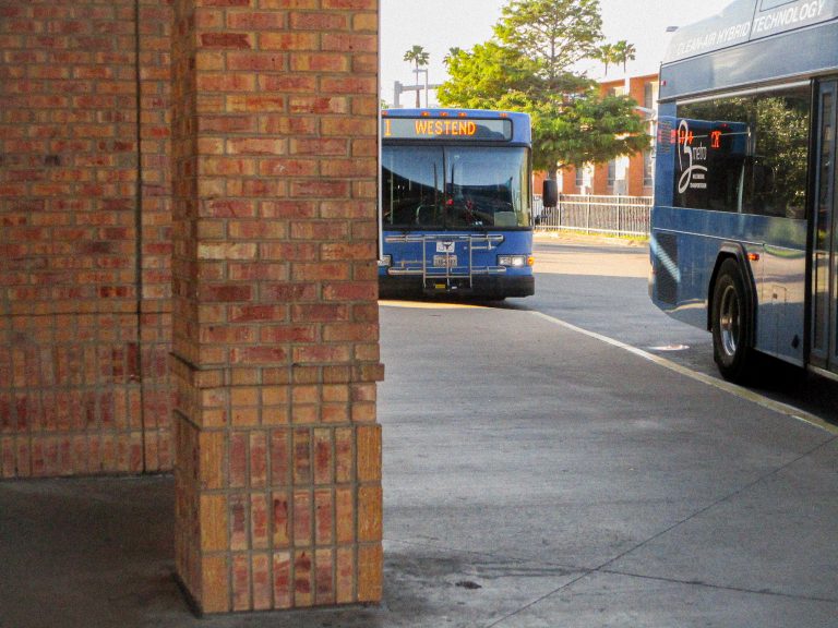 Two blue B-Metro buses at the end of the day at Brownsville’s downtown terminal.