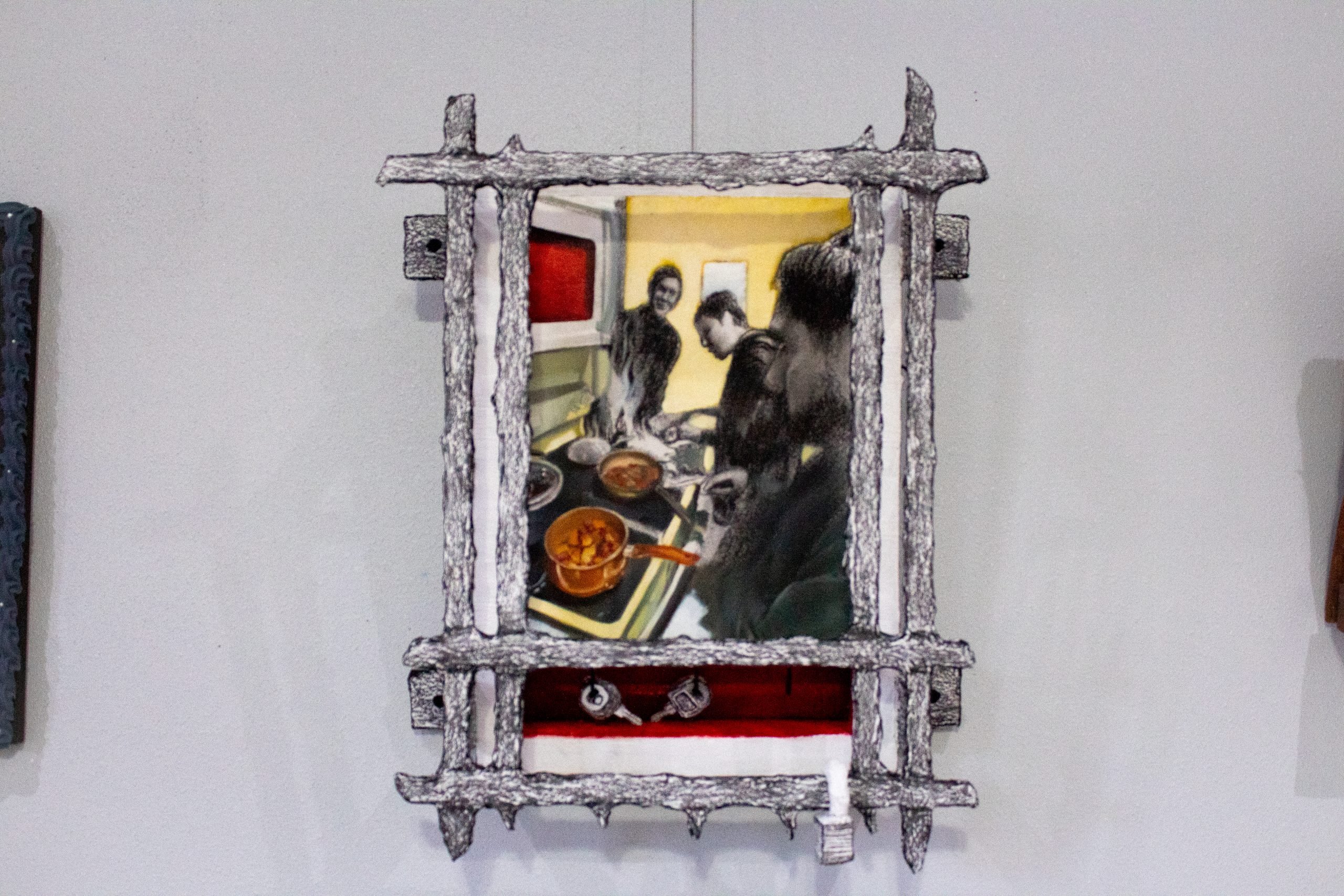 A photo of a single artwork hanging on a studio’s walls.