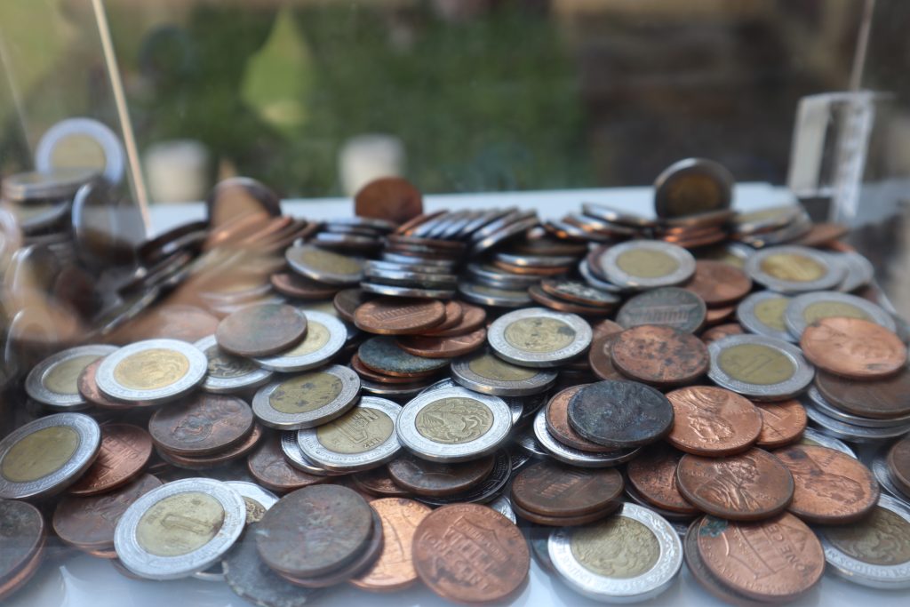 A pile of pennies and pesos.
