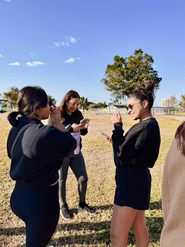 Three people socializing after their club meetup.