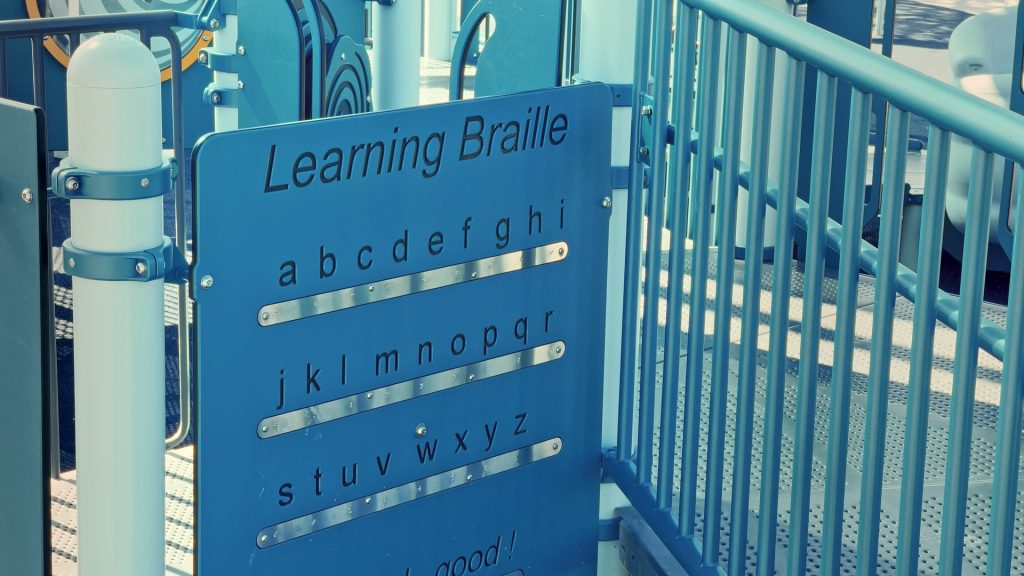 A blue sign of the Braille alphabet.
