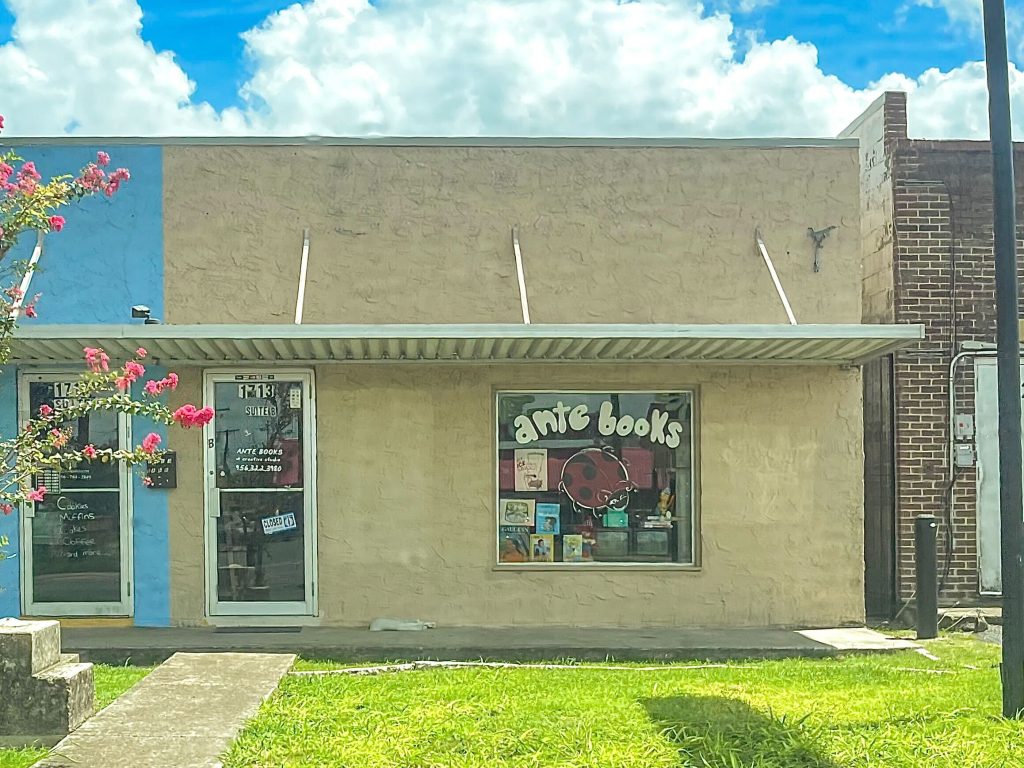Storefront beige building with a window that says "ante books"