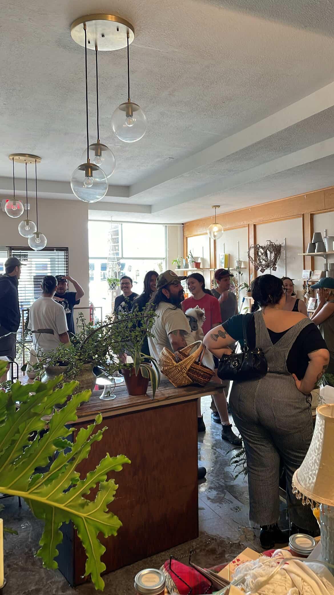 A group of people gathered together inside Bequita’s Blooms in Harlingen, Texas.