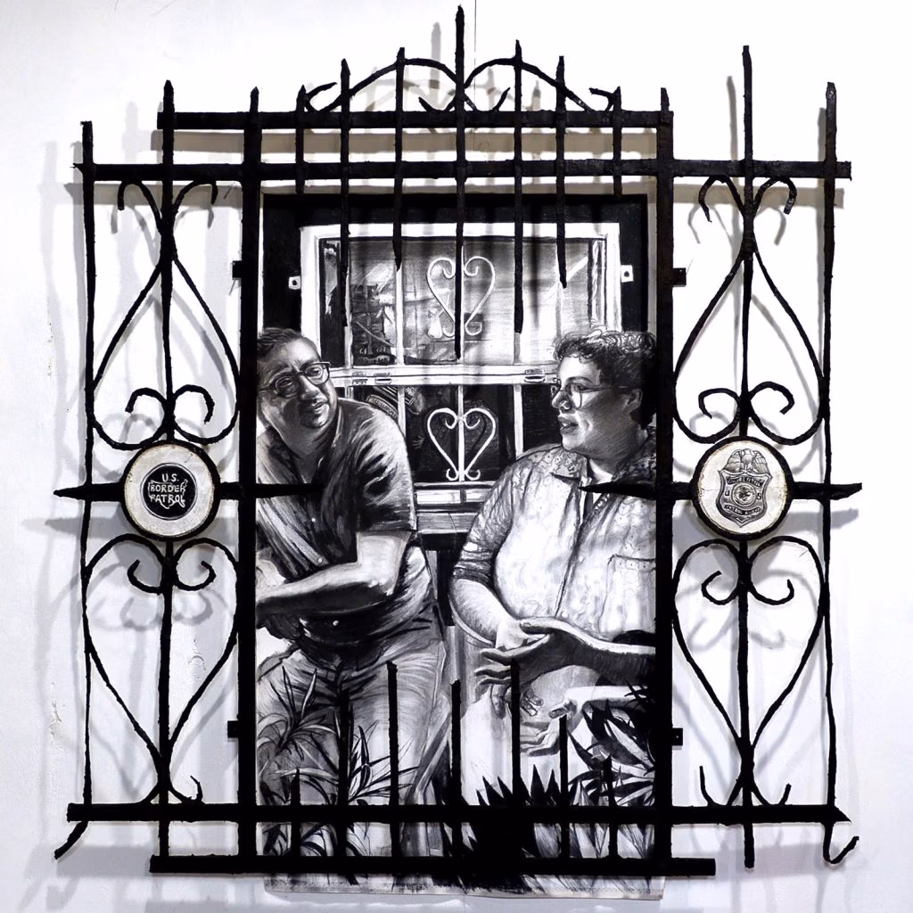 Burglar bars bearing U.S. Customs and Border Protection symbols juxtapose a fresco of artists Gil Rocha and Ray Madrigal, who stand beside a window fitted with painted bars. 