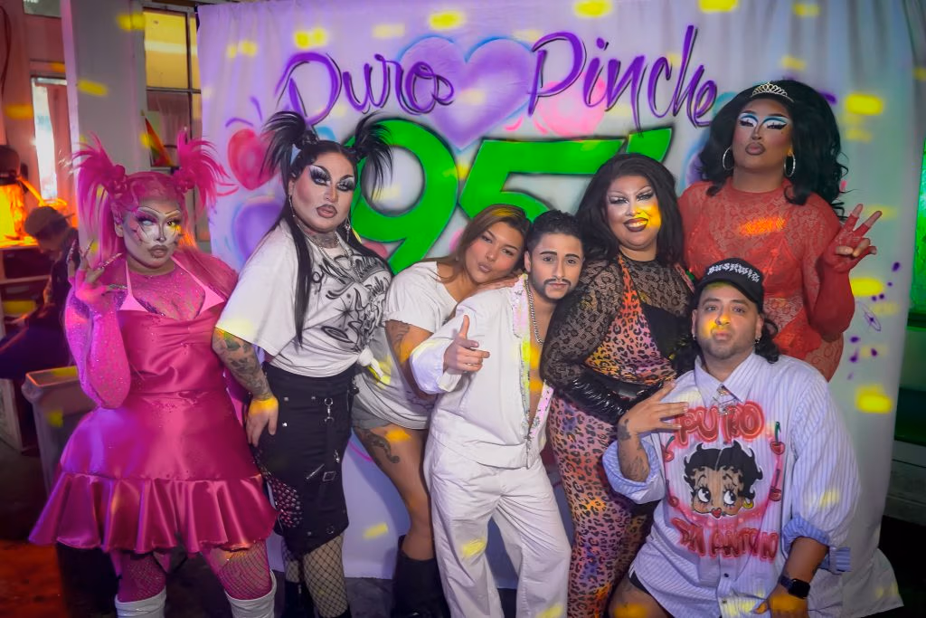 Drag queens posing for a photo.